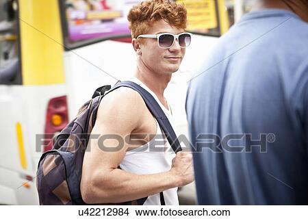 Picture - Two men walking along street. Fotosearch