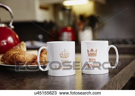 Stock Image - "Two mugs on table, close up". Fotosearch