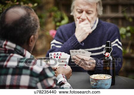 Two senior men playing cards View Large Photo Image Stock Image - Two senior men playing cards. Fotosearch