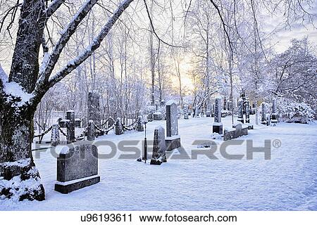 "View of grave stones in snow covered cemetery at dusk, Hemavan, Sweden" View Large Photo Image Stock Image - "View of grave stones in snow covered cemetery at dusk, Hemavan, Sweden". Fotosearch