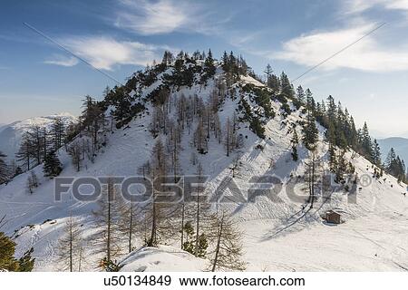 Stock Photo - "View of snow covered mountain, Katrin, Bad Ischl, Austria". Fotosearch