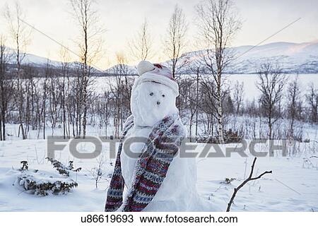 "View of snowman looking over its shoulder, Hemavan, Sweden" View Large Photo Image Stock Image - "View of snowman looking over its shoulder, Hemavan, Sweden". Fotosearch