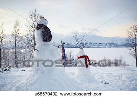 "View of two snowmen wearing scarves, Hemavan, Sweden" View Large Photo Image Stock Image - "View of two snowmen wearing scarves, Hemavan, Sweden". Fotosearch