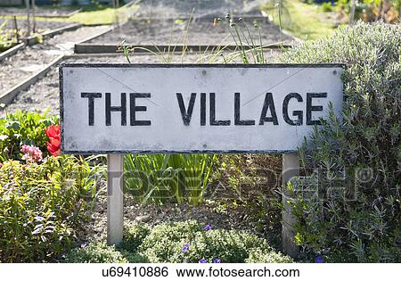 Stock Photograph - Village sign in garden. Fotosearch