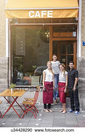 "Waiter and waitresses outside cafe, portrait" View Large Photo Image Stock Image - "Waiter and waitresses outside cafe, portrait". Fotosearch