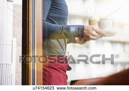 "Waiter carrying drinks, cropped" View Large Photo Image Stock Image - "Waiter carrying drinks, cropped". Fotosearch