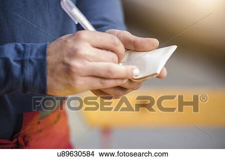Picture - "Waiters hands taking order, cropped". Fotosearch