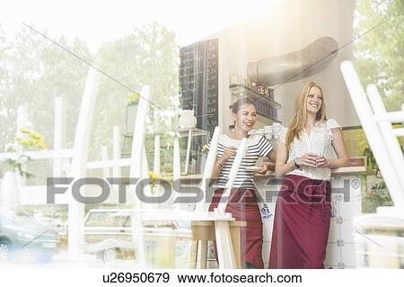 "Waitresses taking a break, view through window" View Large Photo Image Stock Photo - "Waitresses taking a break, view through window". Fotosearch
