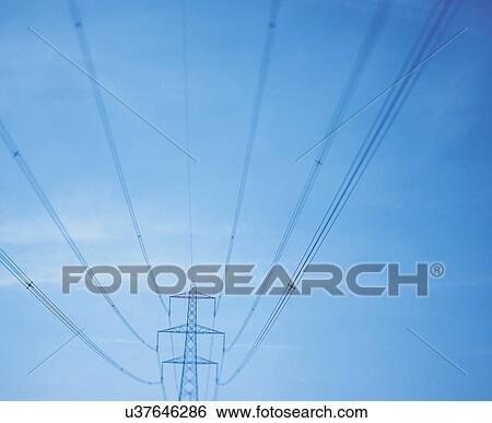 Stock Photograph - Wide angle view of electricity pylon against blue sky. Fotosearch