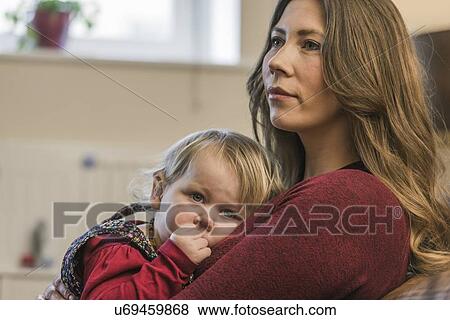 Woman and child relaxing at home View Large Photo Image Stock Photo - Woman and child relaxing at home. Fotosearch