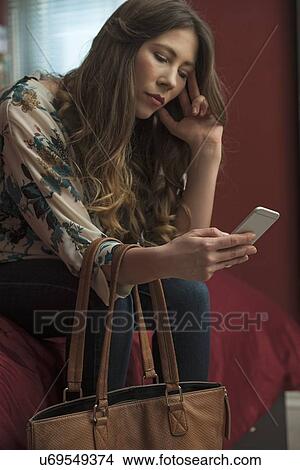 Woman using smartphone View Large Photo Image Picture - Woman using smartphone. Fotosearch