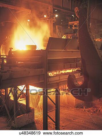 Worker in large steel foundry View Large Photo Image Stock Photo - Worker in large steel foundry. Fotosearch