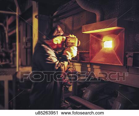 Worker measuring glass furnace temperature View Large Photo Image Stock Image - Worker measuring glass furnace temperature. Fotosearch