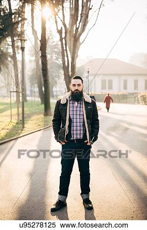 Young bearded man in park View Large Photo Image Stock Photography - Young bearded man in park. Fotosearch