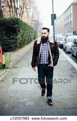 Young bearded man on pavement View Large Photo Image Stock Image - Young bearded man on pavement. Fotosearch
