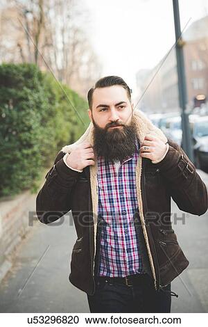 Young bearded man on pavement View Large Photo Image Stock Image - Young bearded man on pavement. Fotosearch