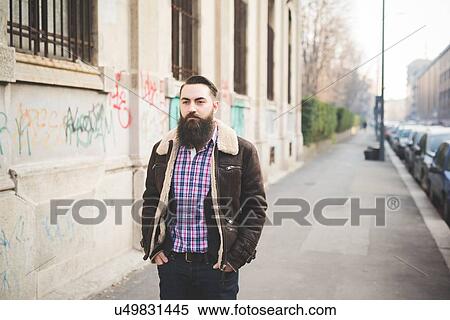Young bearded man on pavement View Large Photo Image Stock Photography - Young bearded man on pavement. Fotosearch