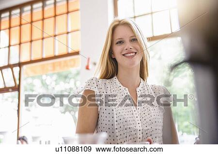 Stock Photo - Young blonde woman smiling. Fotosearch