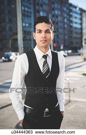 "Young businessman in the street, Milan, Italy" View Large Photo Image Stock Image - "Young businessman in the street, Milan, Italy". Fotosearch