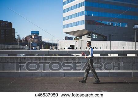 "Young businessman in the street, Milan, Italy" View Large Photo Image Stock Image - "Young businessman in the street, Milan, Italy". Fotosearch