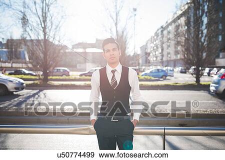 "Young businessman in the street, Milan, Italy" View Large Photo Image Stock Photo - "Young businessman in the street, Milan, Italy". Fotosearch