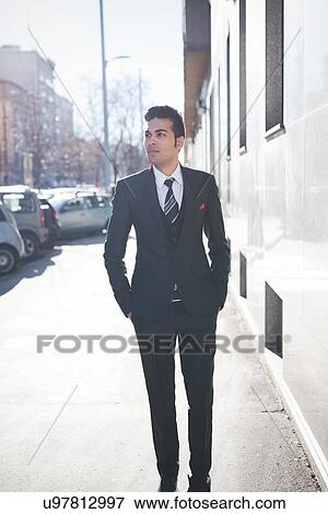 "Young businessman in the street, Milan, Italy" View Large Photo Image Stock Photo - "Young businessman in the street, Milan, Italy". Fotosearch