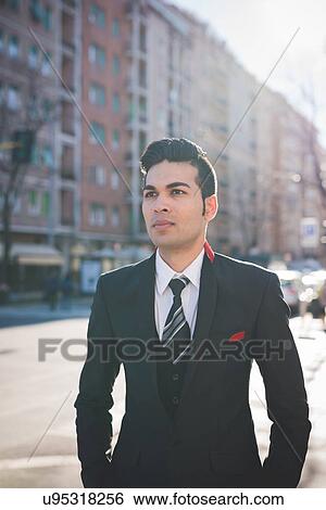 "Young businessman in the street, Milan, Italy" View Large Photo Image Stock Photograph - "Young businessman in the street, Milan, Italy". Fotosearch