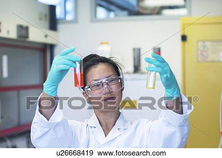 Young female scientist comparing two samples in lab View Large Photo Image Stock Photo - Young female scientist comparing two samples in lab. Fotosearch
