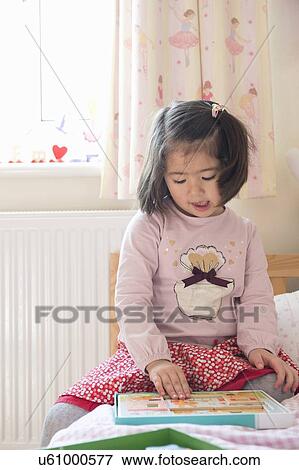 Young girl doing puzzle View Large Photo Image Stock Photo - Young girl doing puzzle. Fotosearch