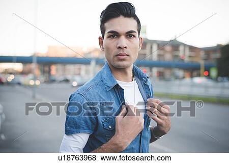 Stock Photo - "Young man in the street, Milan, Italy". Fotosearch