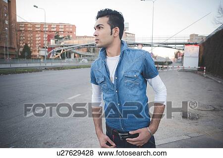 Stock Photo - "Young man in the street, Milan, Italy". Fotosearch