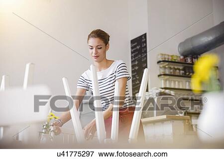 Young waitress working in cafe View Large Photo Image Stock Photo - Young waitress working in cafe. Fotosearch