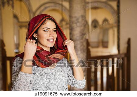 Stock Photography - "Young woman in mosque, wearing headscarf, Istanbul, Turkey". Fotosearch