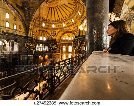 Stock Photography - "Young woman inside Hagia Sophia mosque, Istanbul, Turkey". Fotosearch