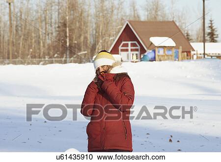 Young woman wearing winter coat in snow View Large Photo Image Stock Image - Young woman wearing winter coat in snow. Fotosearch