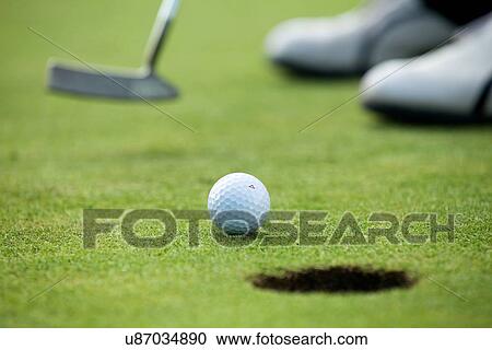 Stock Image - A golf club on a golf course. Fotosearch