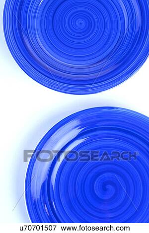 Stock Photo - Blue plates on white background. Fotosearch