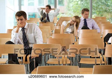 bored Business executives sitting in conference room View Large Photo Image Stock Image - bored Business executives sitting in conference room. Fotosearch