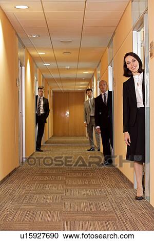 Business people standing in corridor View Large Photo Image Stock Image - Business people standing in corridor. Fotosearch