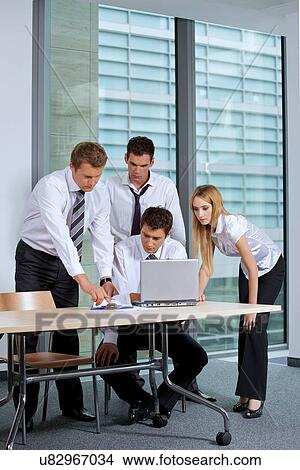 Picture - Business team working in office. Fotosearch