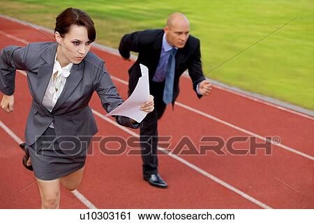 Businessman and woman on running on race track View Large Photo Image Stock Image - Businessman and woman on running on race track. Fotosearch