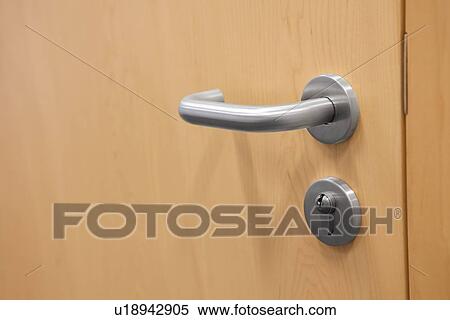 Stock Photography - Businessman searching business card from stand. Fotosearch