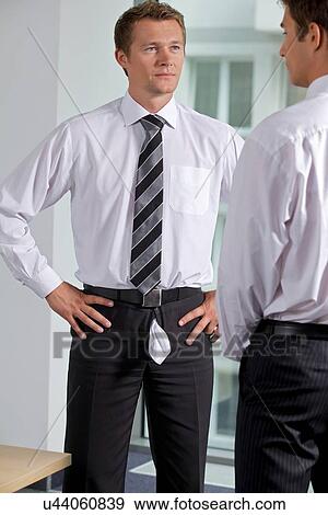 Businessmen at office View Large Photo Image Stock Photo - Businessmen at office. Fotosearch