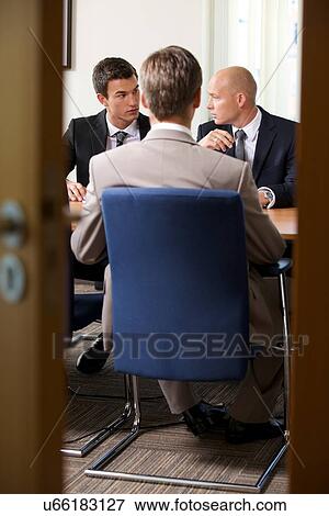 Businessmen in meeting at board room View Large Photo Image Stock Photo - Businessmen in meeting at board room. Fotosearch