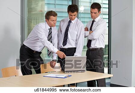 Businessmen working in office View Large Photo Image Stock Photography - Businessmen working in office. Fotosearch