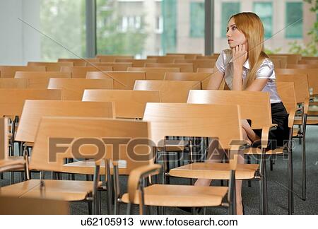 Businesswoman contemplating at conference room in office View Large Photo Image Stock Image - Businesswoman contemplating at conference room in office. Fotosearch
