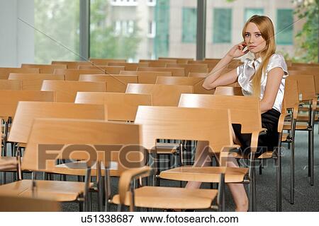 Businesswoman contemplating at conference room in office View Large Photo Image Stock Photo - Businesswoman contemplating at conference room in office. Fotosearch