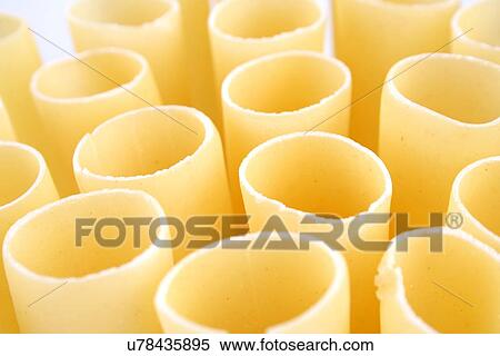 Stock Photography - Cannelloni raw pasta on white background. Fotosearch