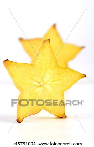 Picture - Carambola on white background - slices. Fotosearch