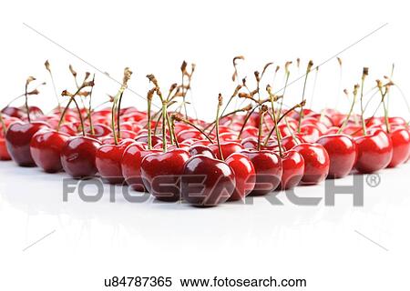 Stock Photography - Cherries on white background - studio shot. Fotosearch